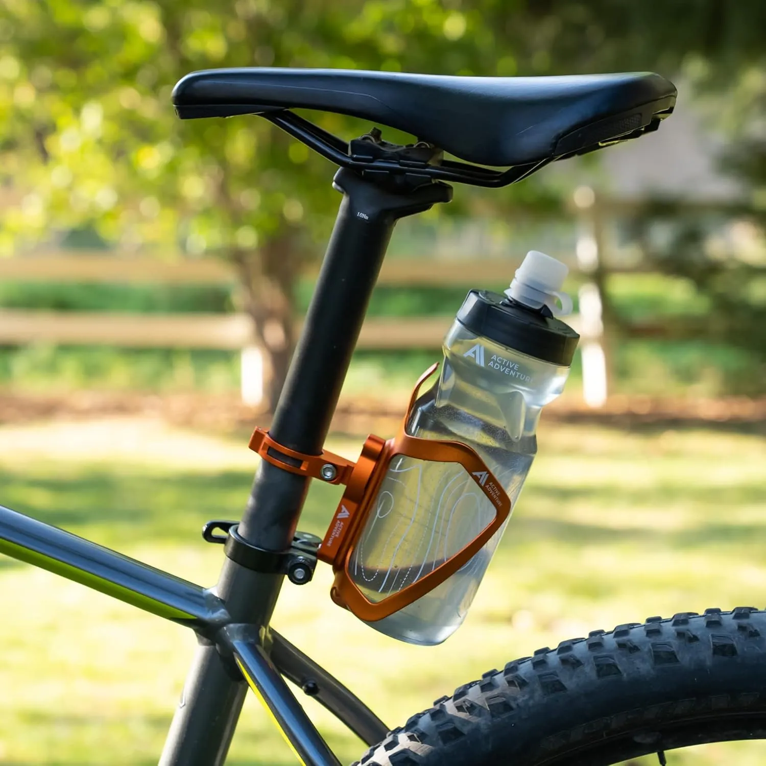 Bike Water Bottle Holder Combo - 20 Oz Squeeze Bottle & Bicycle Mount Cage Rack, No Screws Needed, Durable Alloy - Fits All Handlebar Bikes & MTB Mountain Road - for Adults, Kids (Orange)