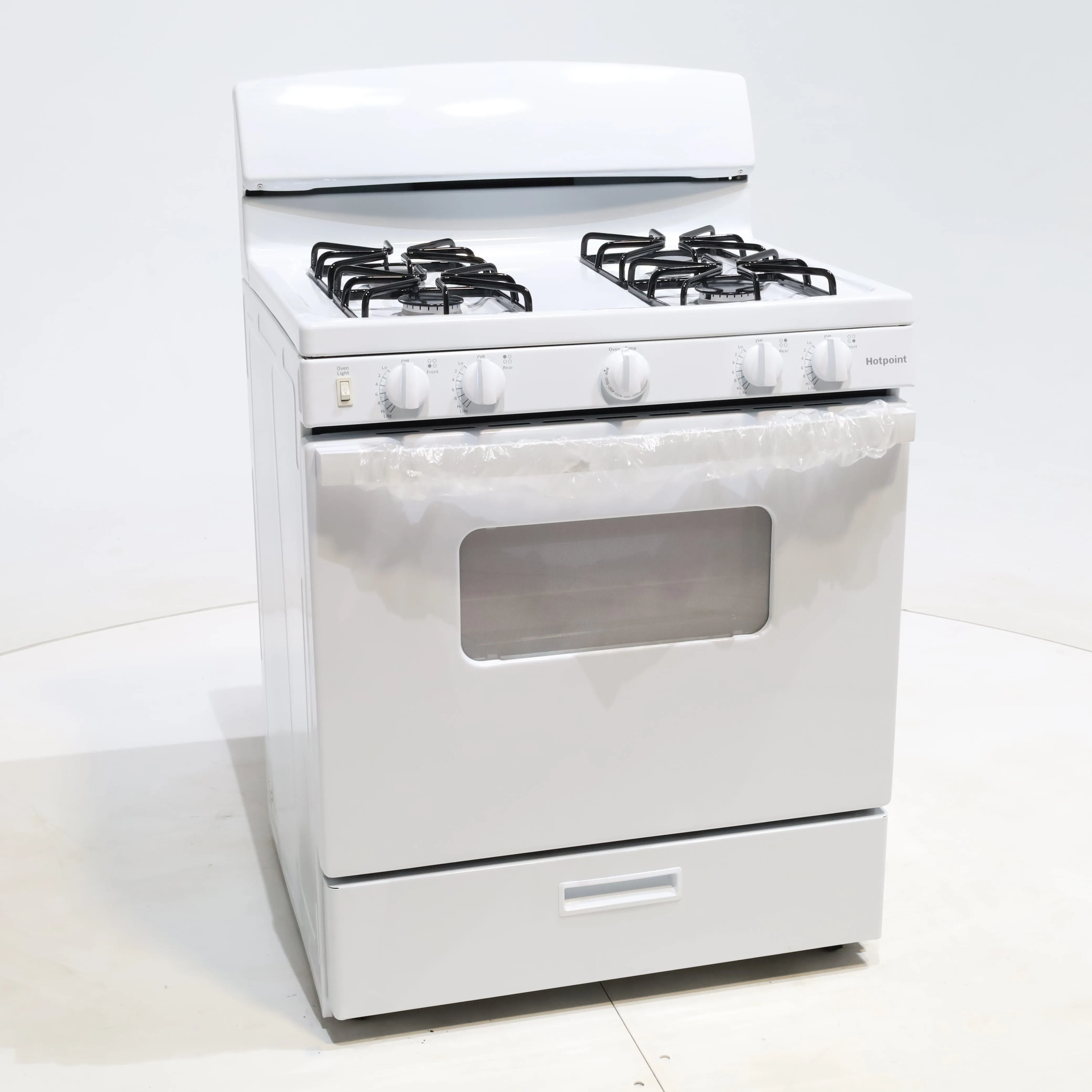 White Hotpoint 4.8 cu. ft. 4 Burner Freestanding Gas Range with Broiler Drawer - Scratch & Dent - Minor