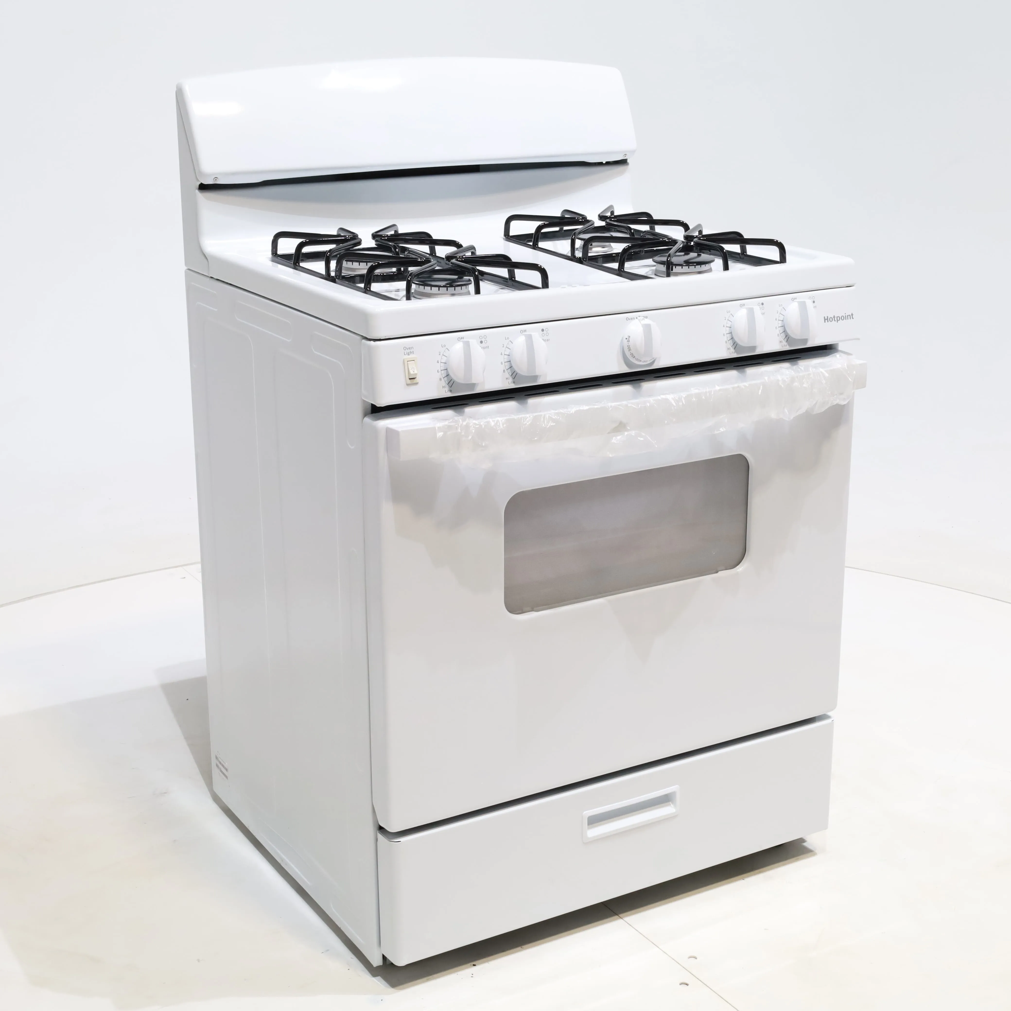 White Hotpoint 4.8 cu. ft. 4 Burner Freestanding Gas Range with Broiler Drawer - Scratch & Dent - Minor