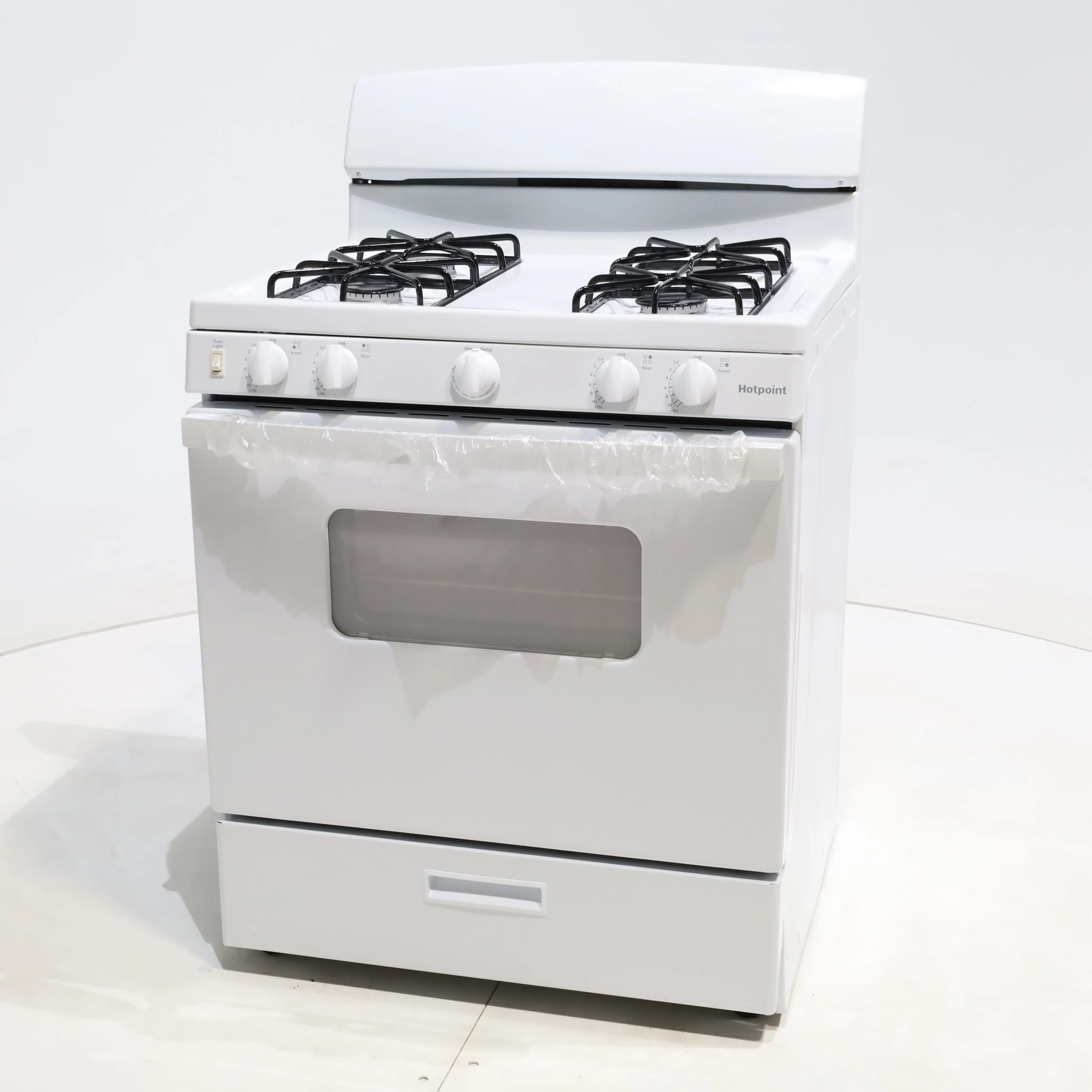 White Hotpoint 4.8 cu. ft. 4 Burner Freestanding Gas Range with Broiler Drawer - Scratch & Dent - Minor