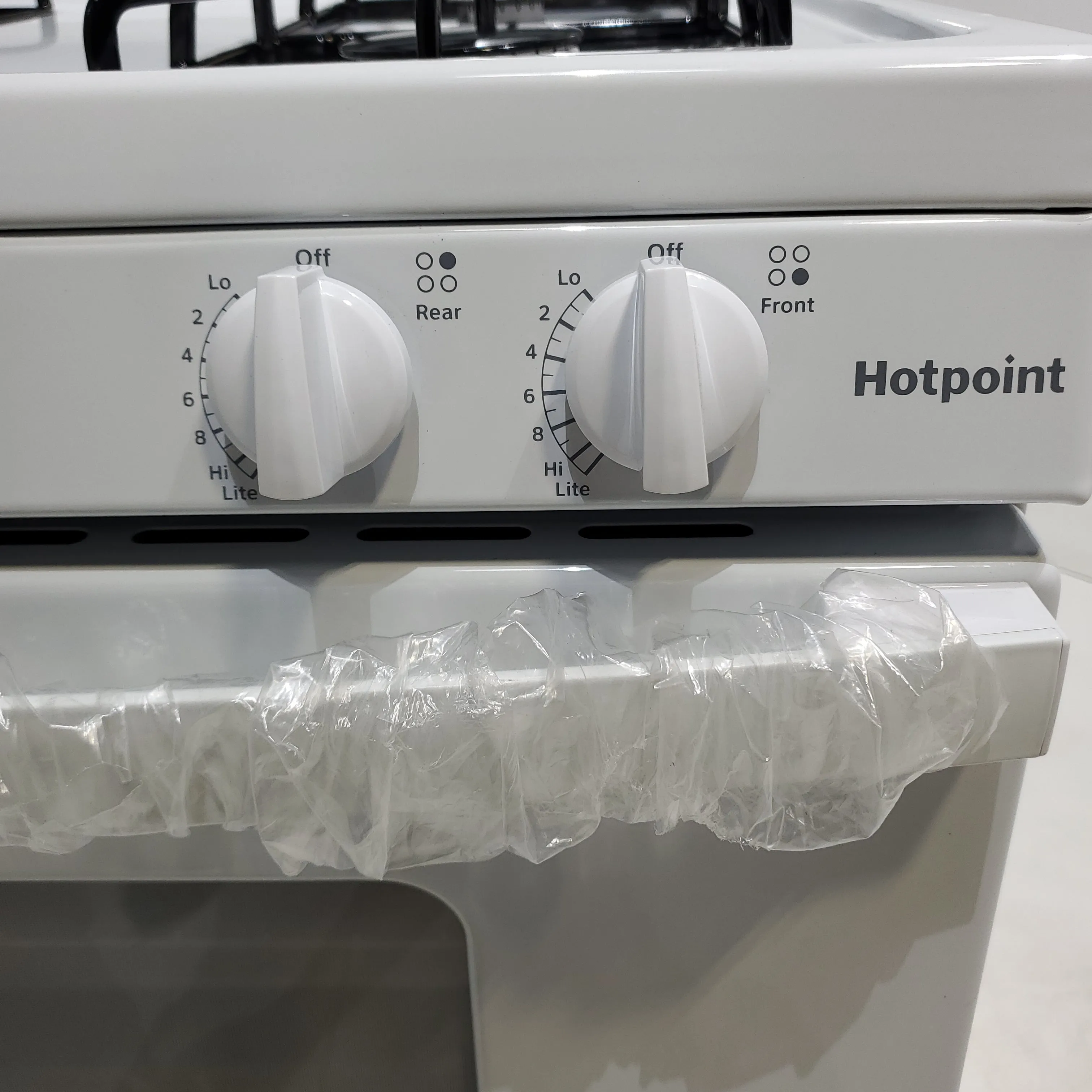 White Hotpoint 4.8 cu. ft. 4 Burner Freestanding Gas Range with Broiler Drawer - Scratch & Dent - Minor